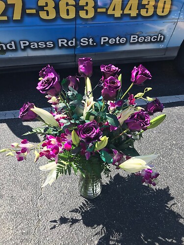 metallic purple roses withorchids &amp; lilies