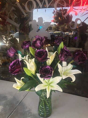 ONE DOZEN METALLIC PURPLE ROSES WITH WHITE CASABLANCA LILIES